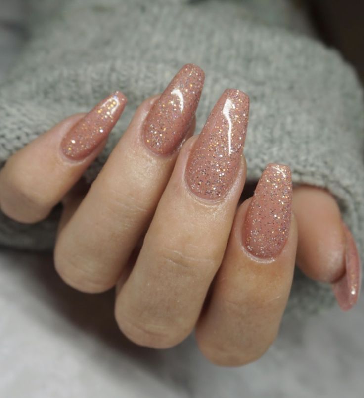 Elegant Shimmering Nude Nails: A Sophisticated Blend of Simplicity and Glamour.