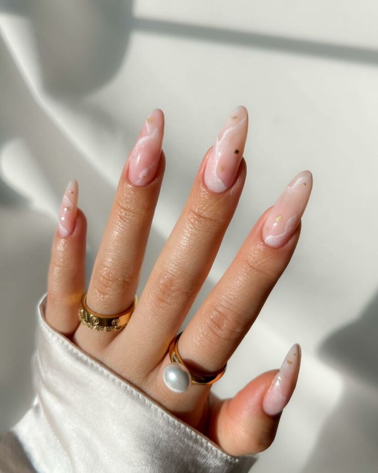 Chic Soft Pink Ombre Nails with Elegant Marbling and Gold Accents