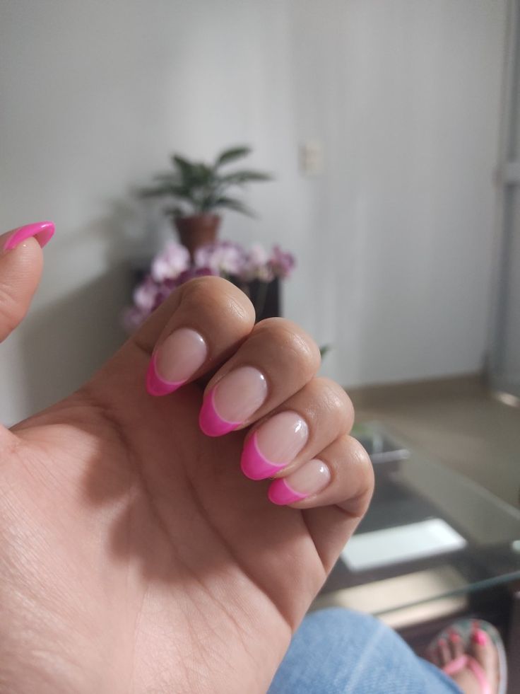 Chic Manicure: Vibrant Pink French Tips on Soft Nude Base for a Modern Aesthetic