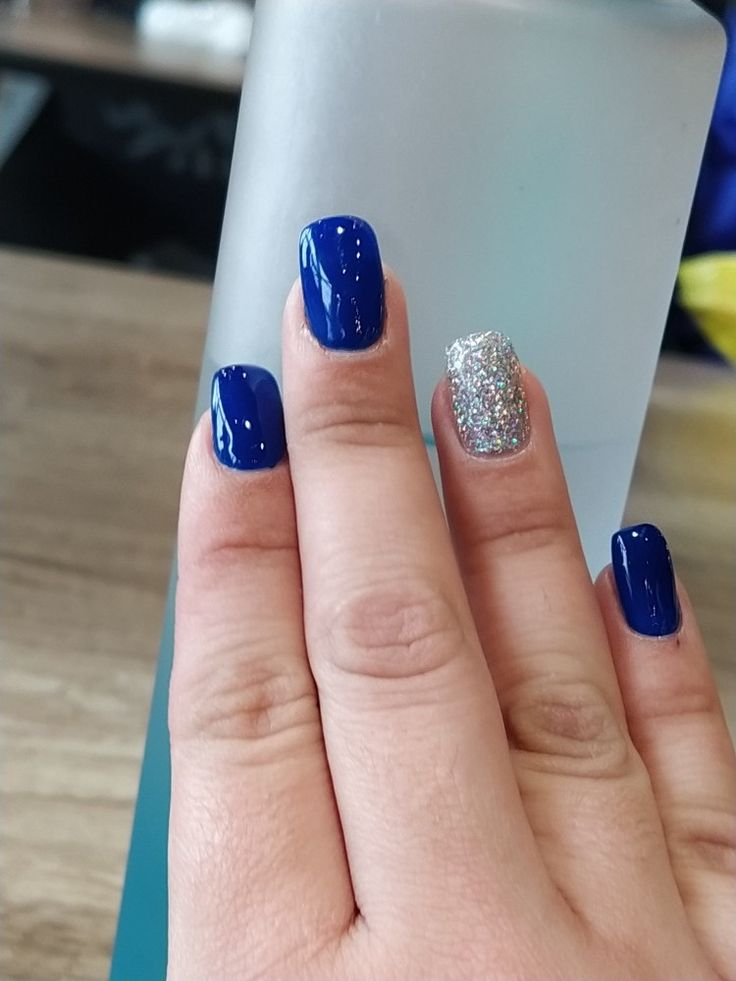 Bold Blue and Sparkling Silver: An Elegant Nail Design for a Glamorous Look.