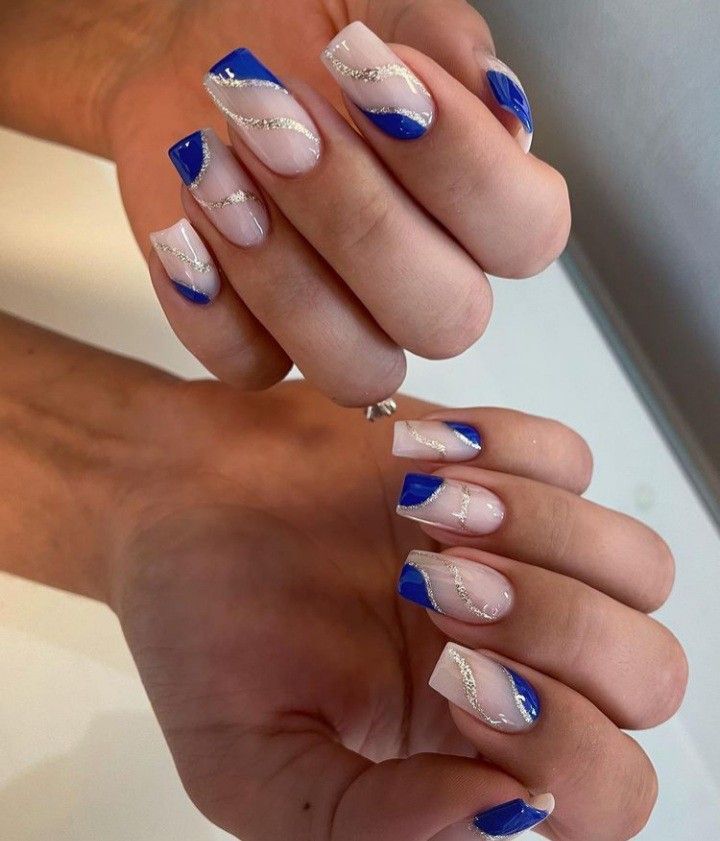 Chic Nail Design: Nude and Vibrant Blue with Elegant Silver Accents