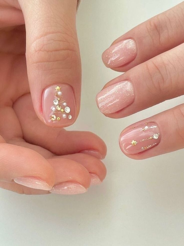 Elegant Subtle Holiday-Inspired Nail Design with Nude Base and Whimsical Accents