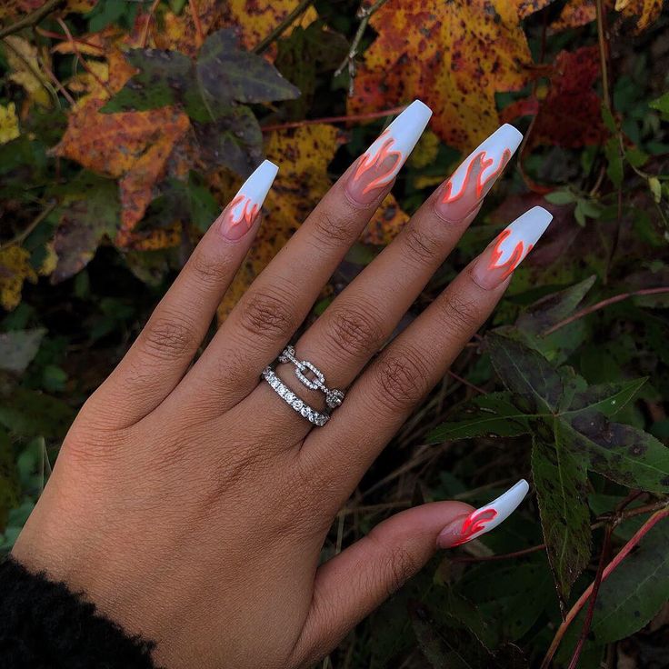 Dramatic Flame-Inspired Coffin Nail Design in Bold White and Orange.