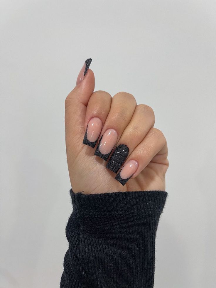 Chic Nude and Black Glitter Nail Design for Elegant Versatility.