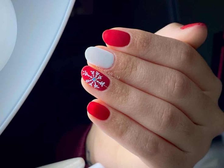 Cheerful Holiday Nail Design: Red and White with Snowflake Accents