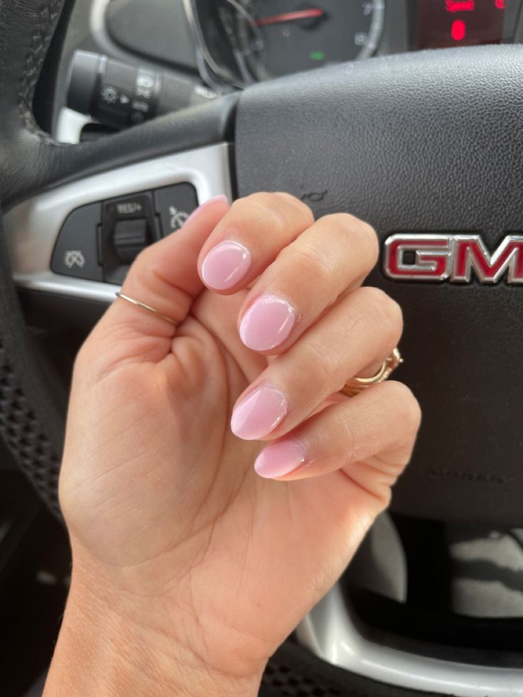 Chic Delicate Pink Glossy Nails: Enhancing Femininity and Elegance for Any Occasion.