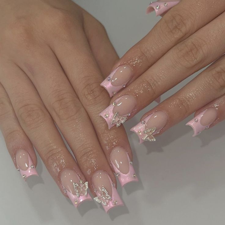 Sophisticated Pink Butterfly Nail Design with Glossy Finish and Elegant Accents.