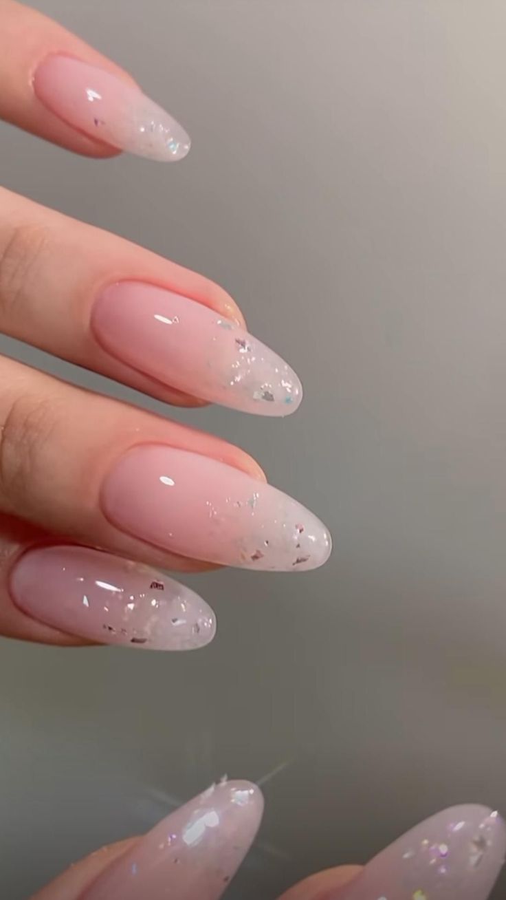 Chic Almond-Shaped Nails with Gradient and Sparkling Elegance.