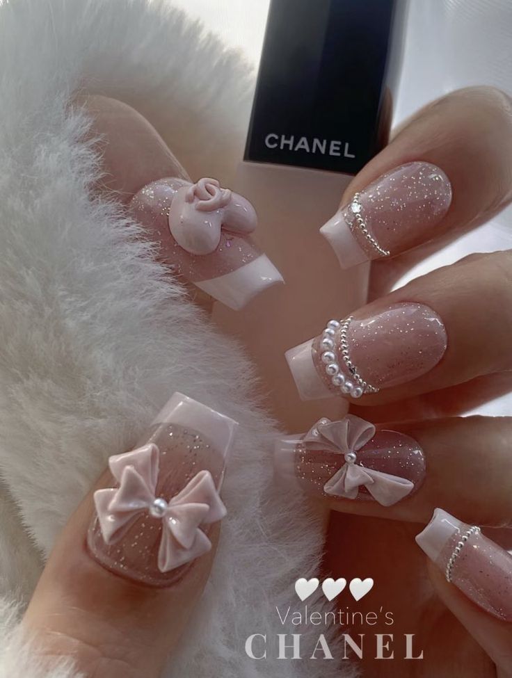 Elegant Soft Pink Nail Design with Delicate Embellishments for Special Occasions.