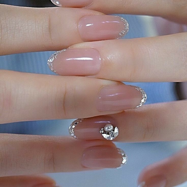 Sophisticated Nude Nails with Silver Tips and Striking Jeweled Accent.