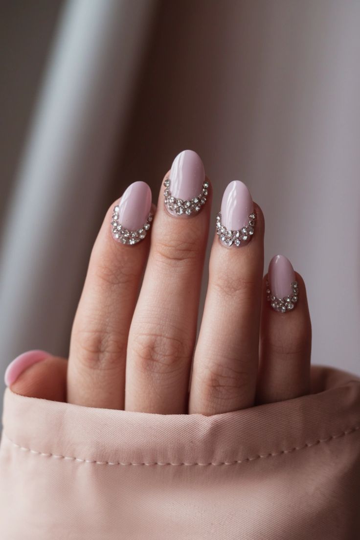 Chic Soft Pink Nail Design with Sparkling Rhinestone Tips for Versatile Elegance.