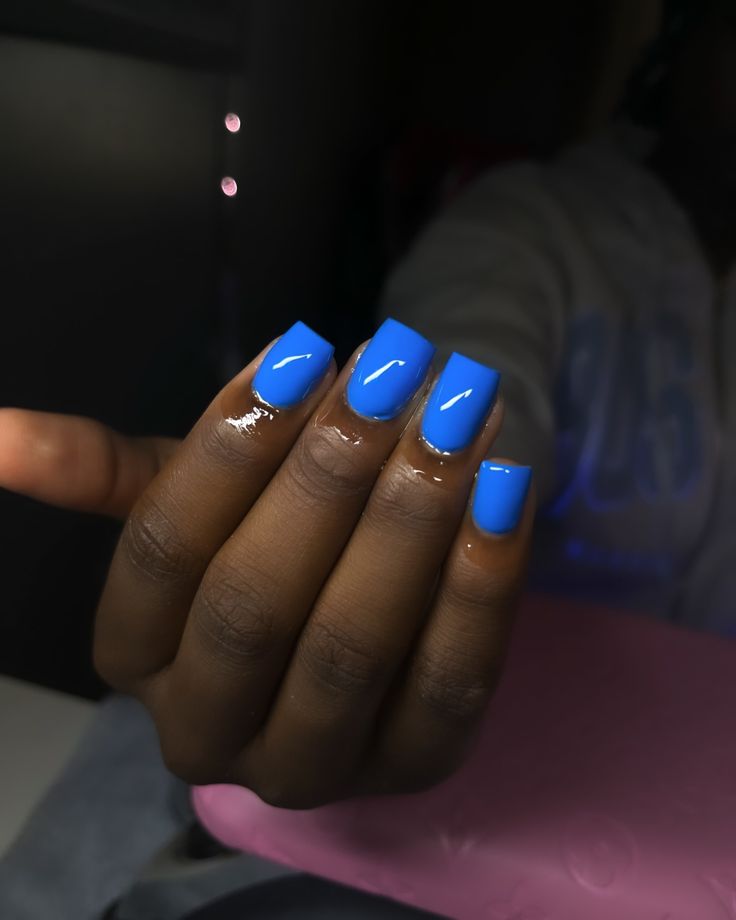 Bold Glossy Blue Nail Design: A Chic and Modern Aesthetic for Any Occasion.