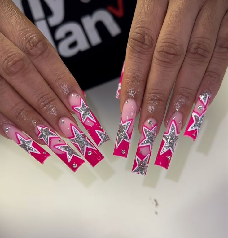 Vibrant Pink and Silver Star-Patterned Long Square Nail Design for a Bold Glamorous Look.