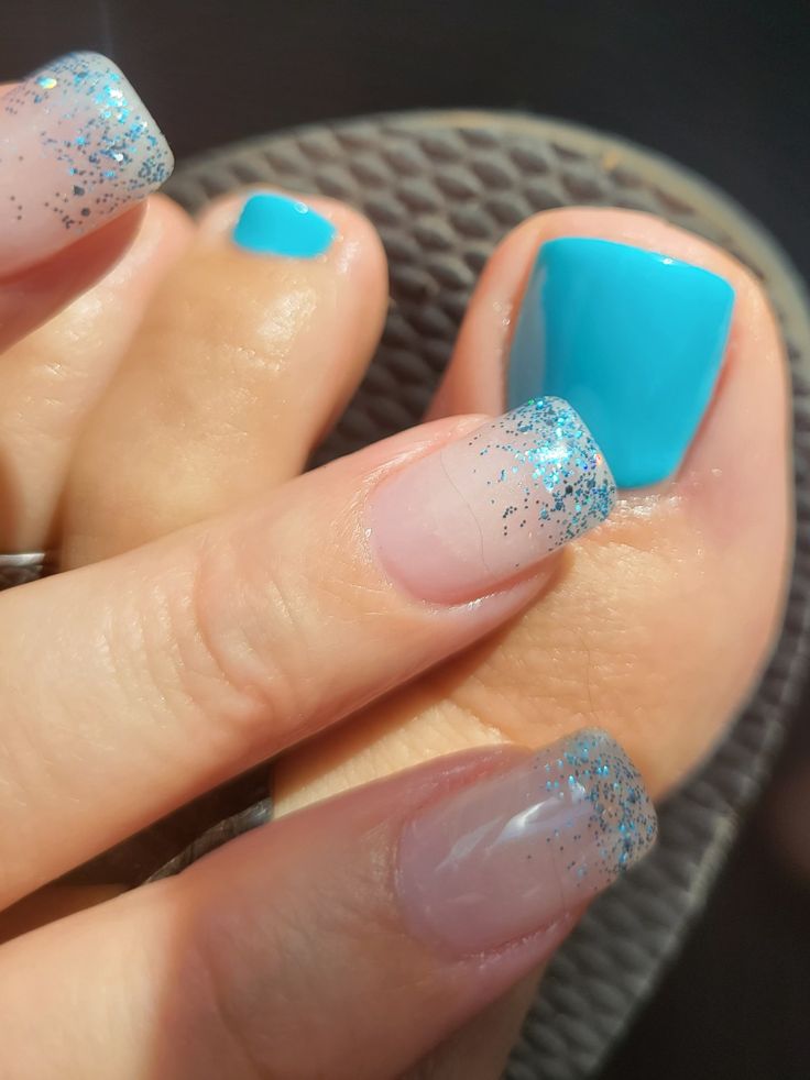 Playful Turquoise Nail Design: Vibrant Toes with Glittery Gradient Fingertips for a Chic Summer Look.