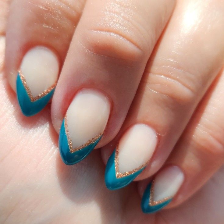 Elegant Chevron Nail Design: Striking Turquoise with Nude and Golden Accents