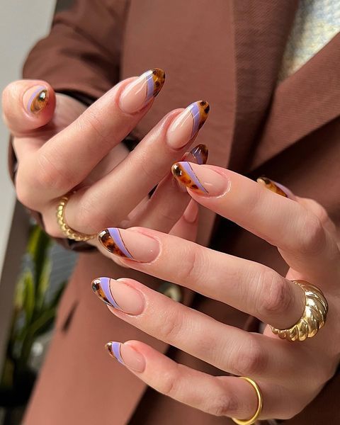 Chic Nail Design: Elegant Geometric Patterns with Tortoiseshell and Lavender Accents.