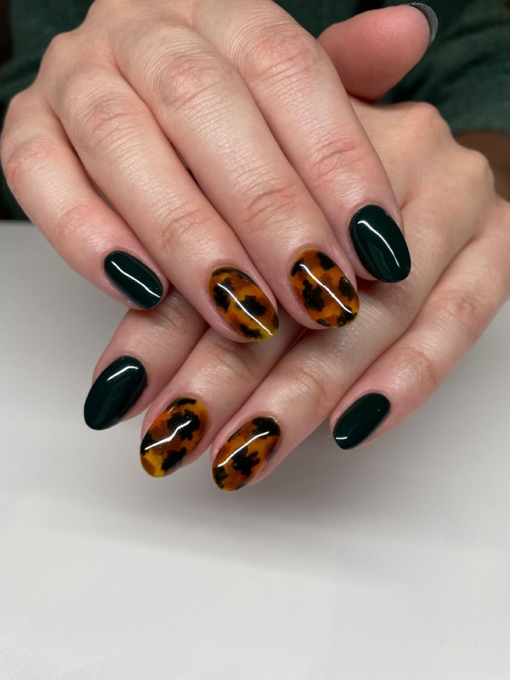 Elegant Tortoiseshell Nail Design with Glossy Finish and Striking Deep Green Accents