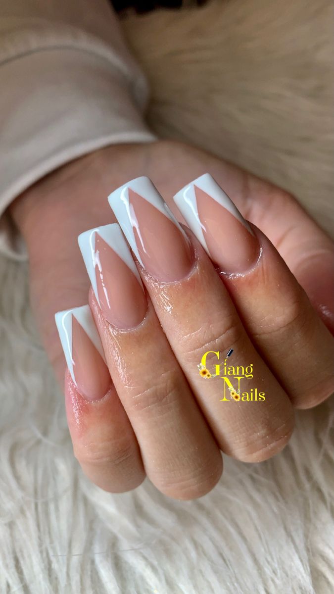 Chic Elegant Nude Nails with Bold White V-Tips: Perfect for Any Occasion