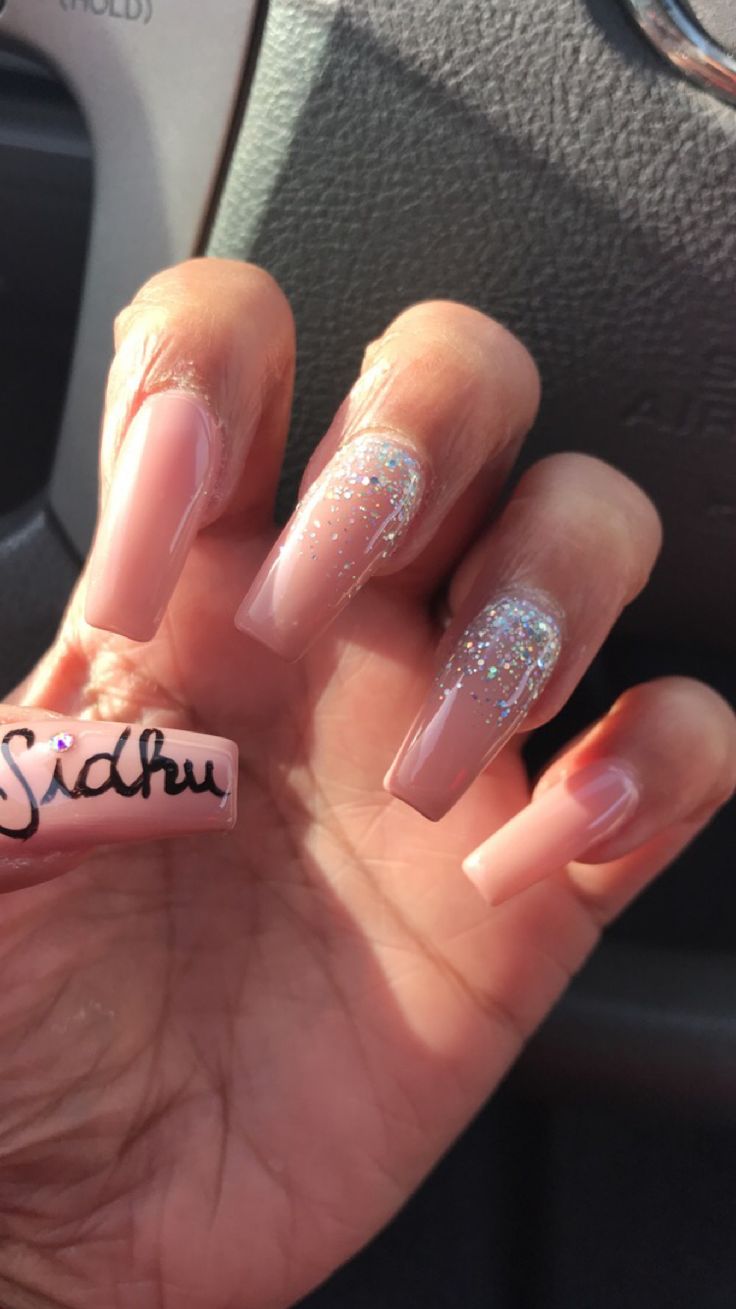 Chic Soft Pink Nail Design with Glitter Accents for a Classy Aesthetic