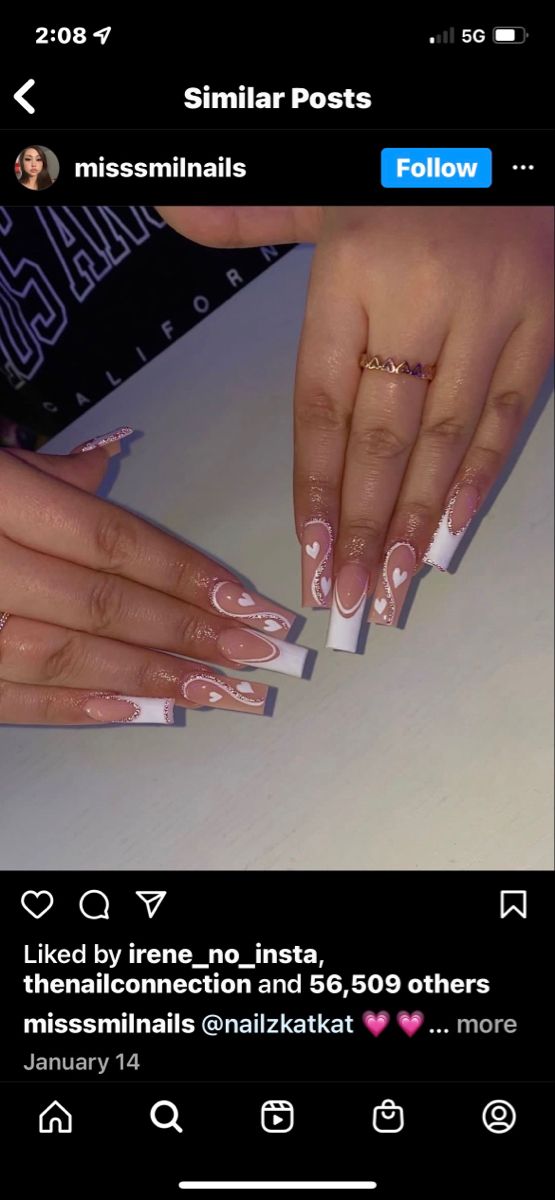 Chic Nail Design: White Tips with Soft Pink Accents and Playful Patterns.