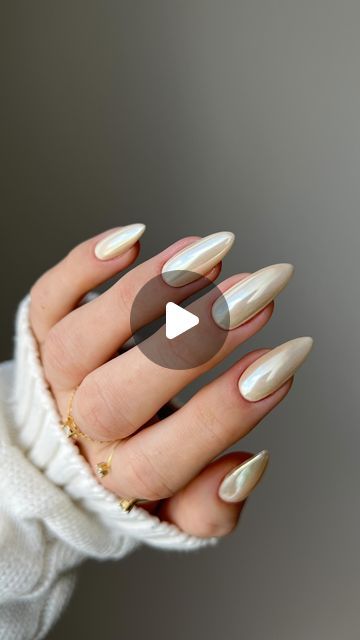 Elegant Almond-Shaped Nails: Glossy Iridescent Finish for Timeless Sophistication.