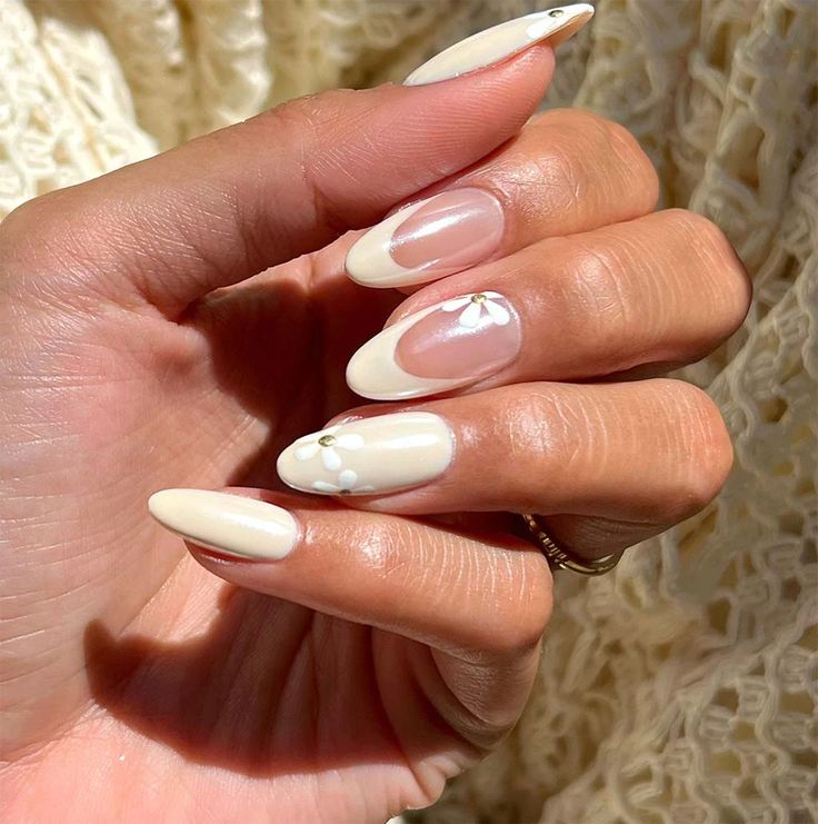 Sophisticated Almond-Shaped Nails with Glossy and Matte Finishes, Floral Designs, and Gem Accents.