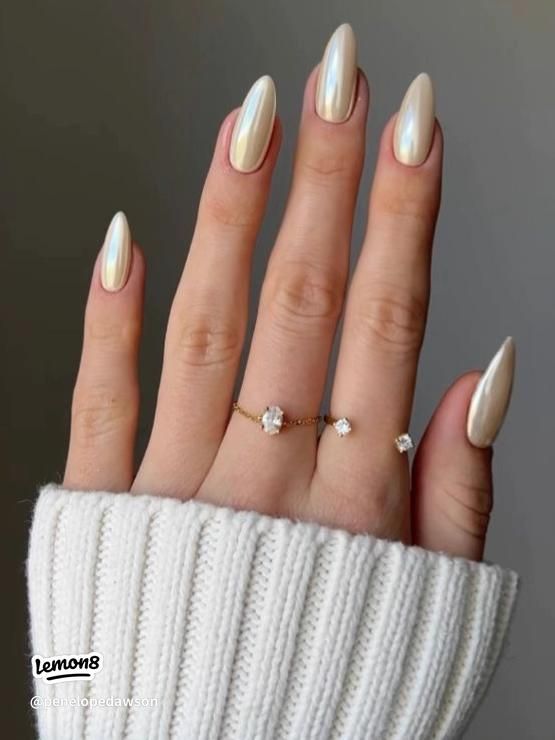 Sophisticated Almond-Shaped Nails with Pearlescent Finish: A Perfect Blend of Understated Glamour and Modern Chic.