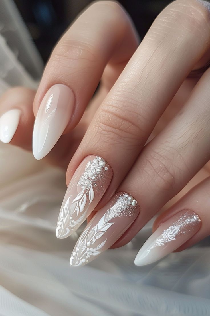 Sophisticated Nail Design: White and Nude Hues with Floral Patterns and Subtle Shimmer