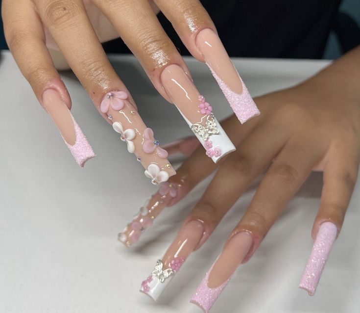 Elegant Long Ombre Nail Design with Floral and Glitter Accents