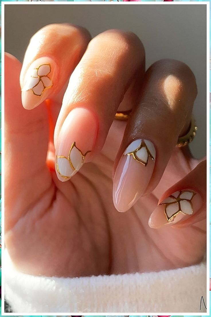 Chic Pastel Floral Nail Design with Elegant Gold Accents