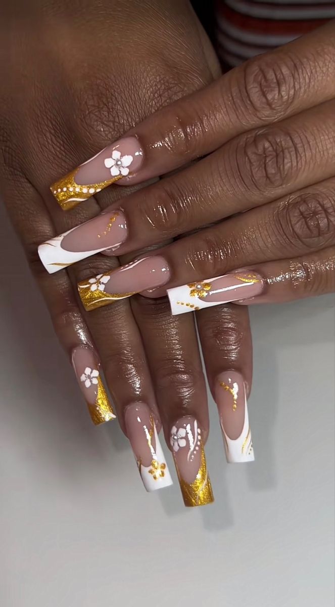 Sophisticated Nude and White Nail Design with Artistic Golden Accents and Intricate Floral Details