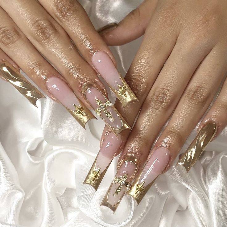 Sophisticated Elegant Nail Design: Soft Pinks with Metallic Gold Accents and Floral Embellishments