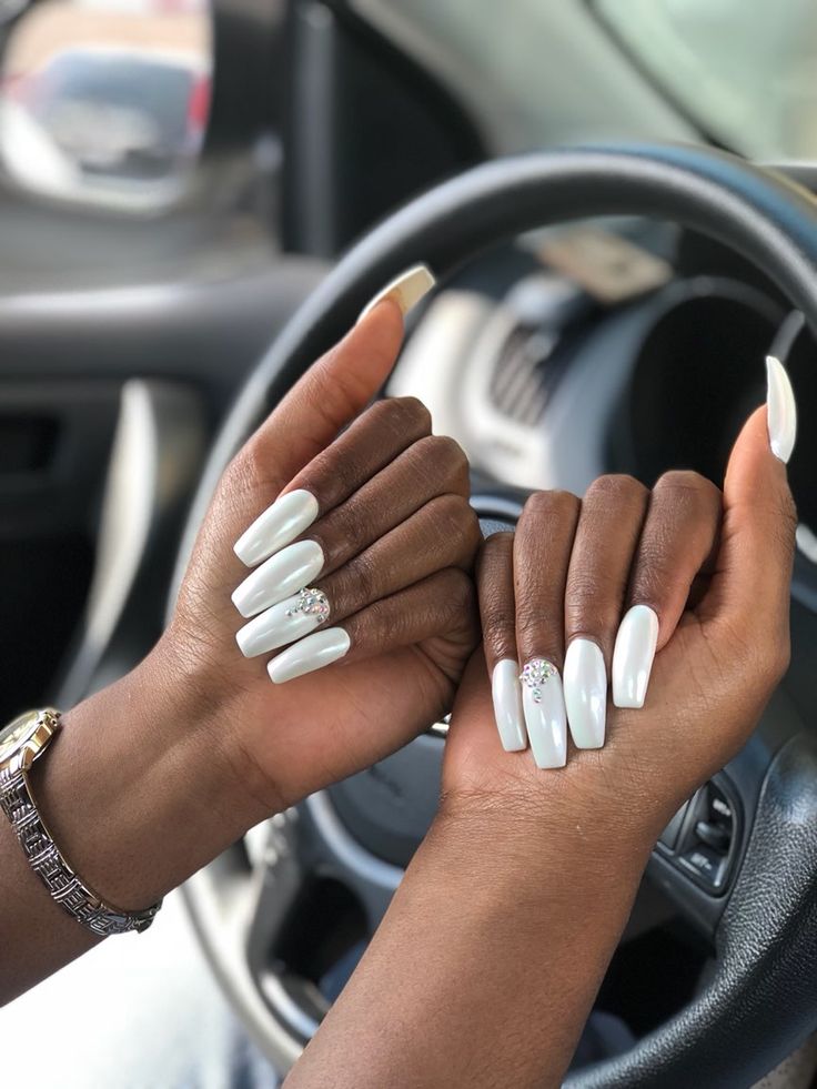 Sophisticated White Manicure with Glamorous Embellishments on Long Square Nails