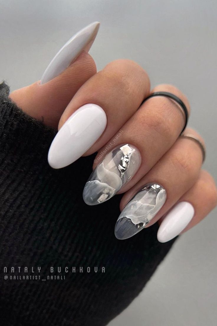 Sophisticated Nail Art: Crisp White and Marbled Gray with Glossy and Metallic Accents.