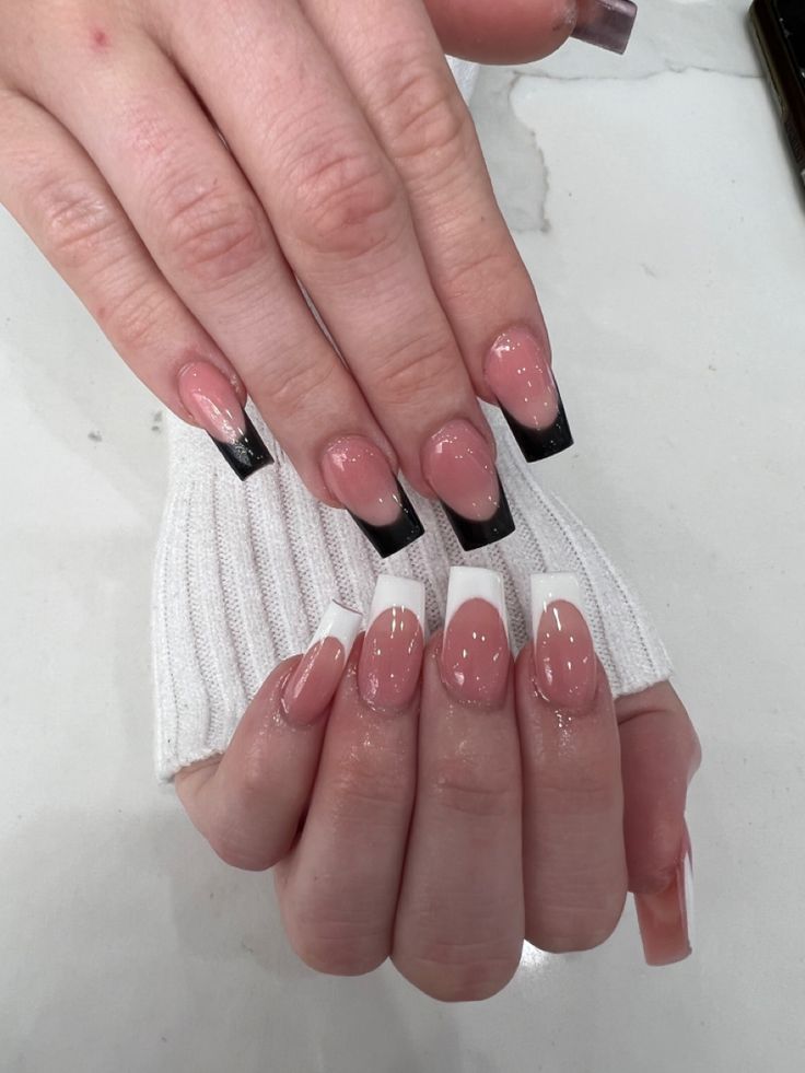 Chic Nail Design: Striking Nude Pink with Bold Black and White Tips.