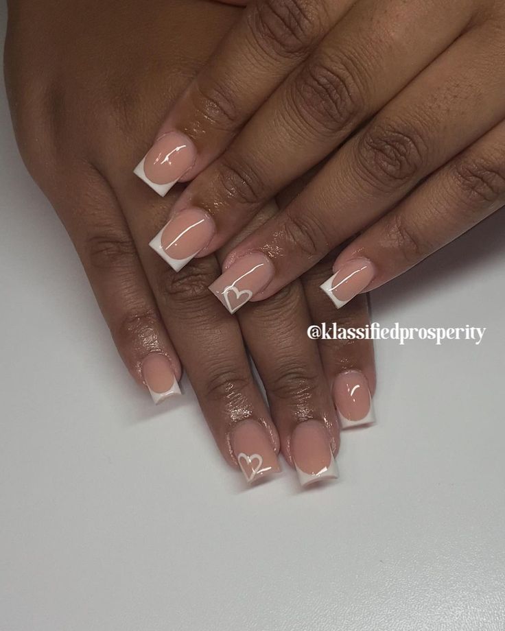 Chic Nude French Tip Nails with Charming Heart Accents: Perfect for Any Occasion