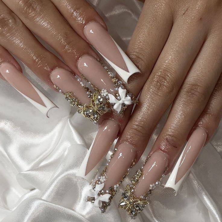 Sophisticated Almond-Shaped Nail Design with Glamorous Nude and White Accents