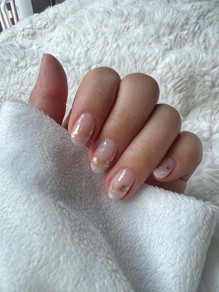 Chic Nude Nails with Gold Accents for Understated Glamour