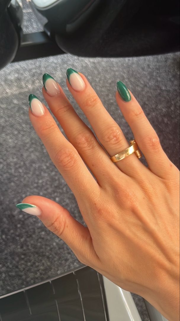 Elegant Almond-Shaped Nails with Sophisticated Nude and Dark Green Design.