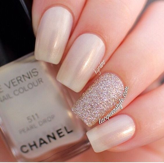 Sophisticated Nail Design: Soft Pearl Shade with Textured Glitter Accent