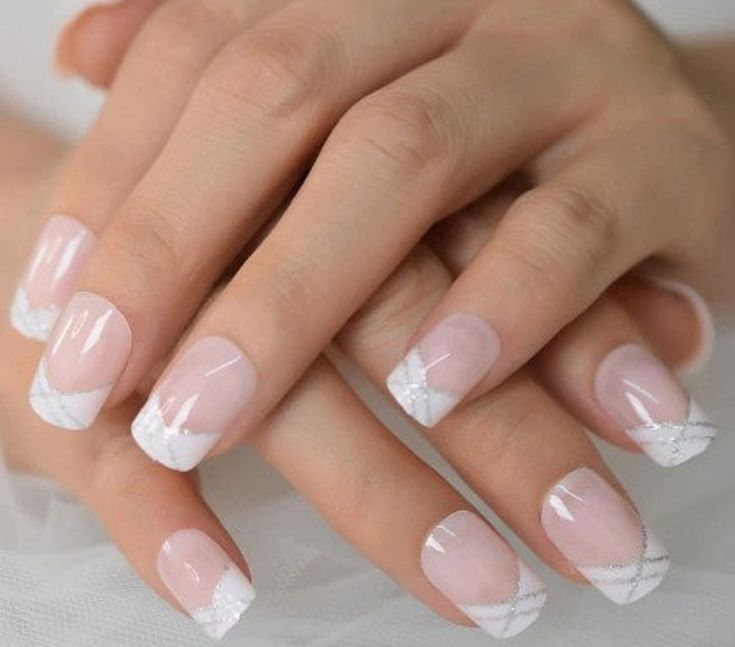 Sophisticated Soft Pink Nail Design with White French Tips and Intricate Diagonal Lines.