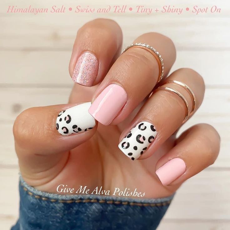 Chic Nail Design: Soft Pink Base with Bold Leopard Accents and Glittering Touch.