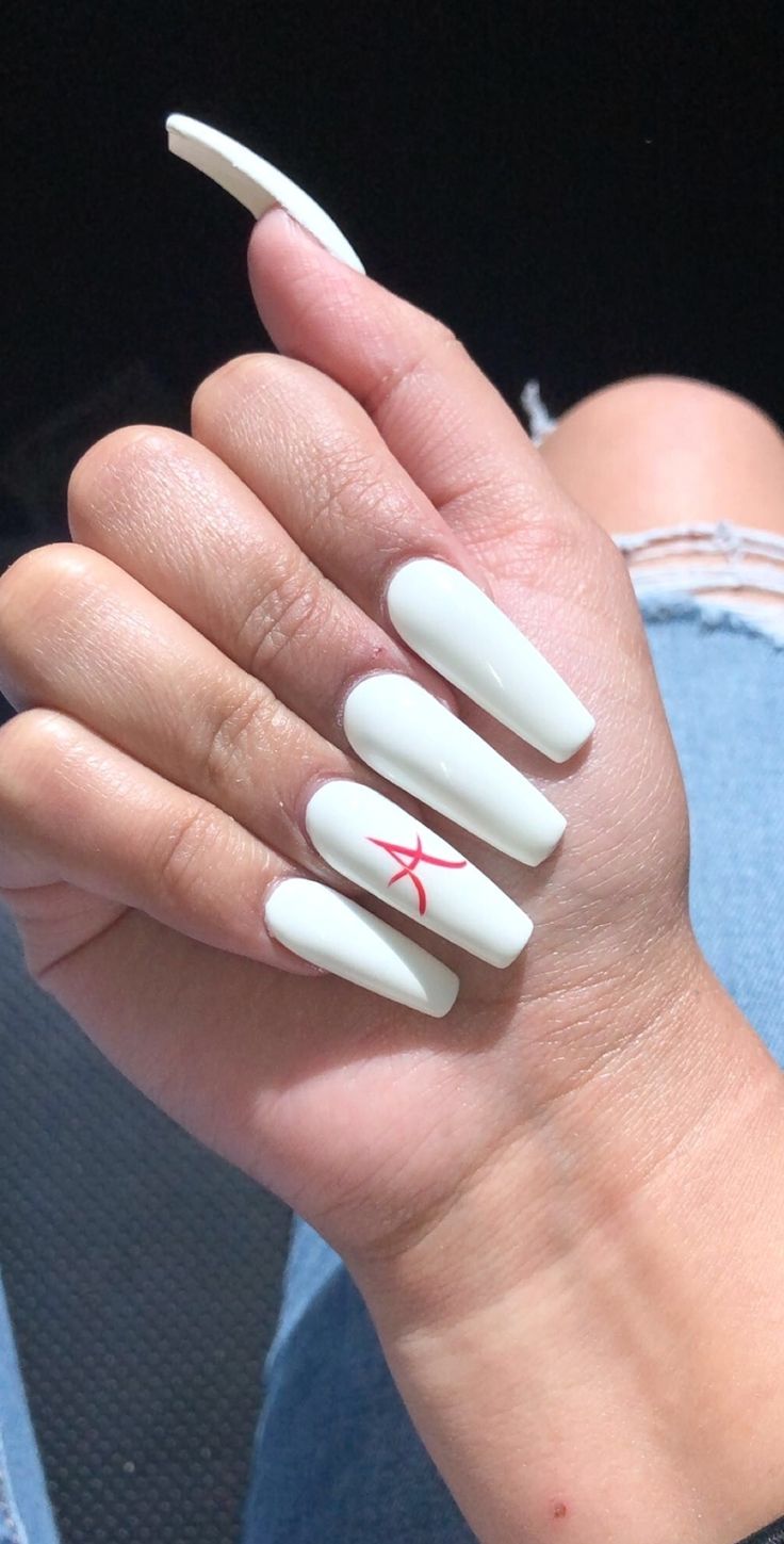 Striking Elegance: Soft White Nails with Bold Red Accent Design