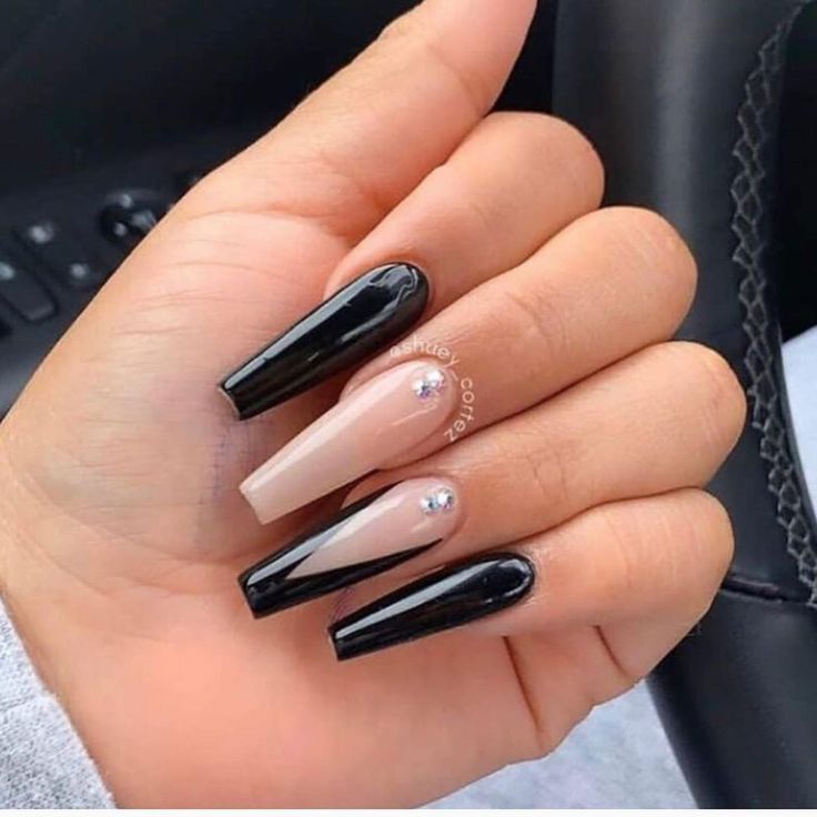 Chic Black and Nude Nail Design with Glamorous Rhinestone Accent