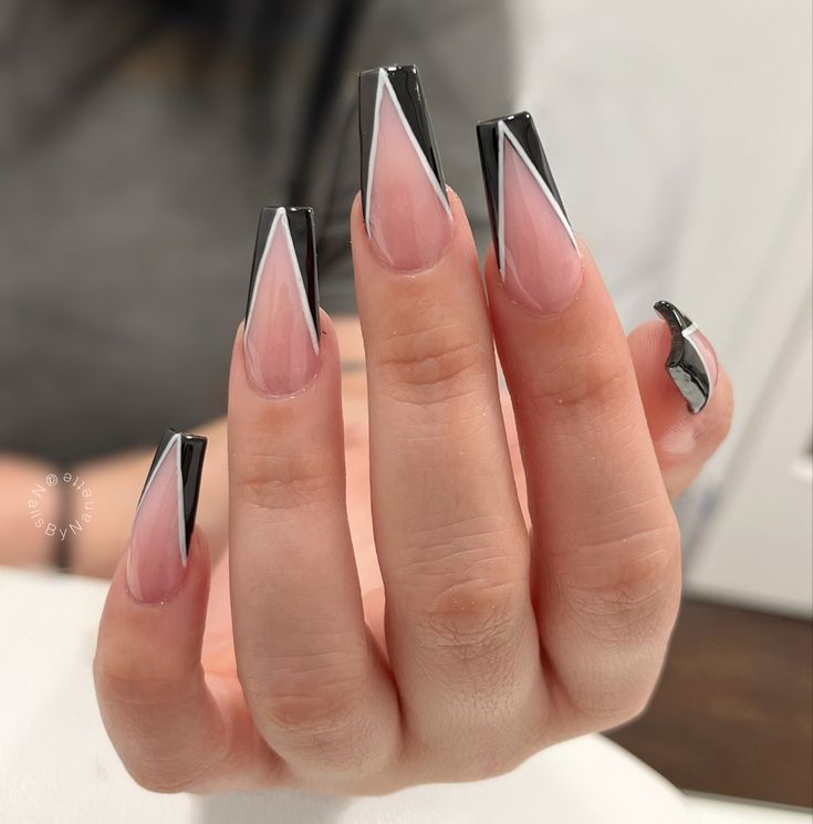 Chic Geometric Nail Design: Elegant Nude with Bold Black and White Accents.