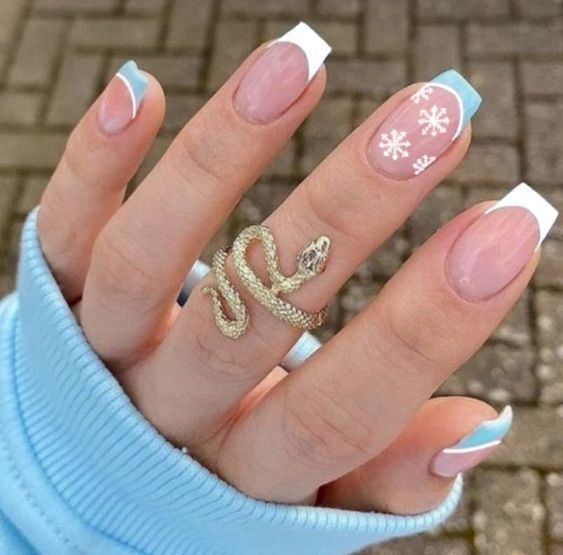 Elegant Pastel Nail Design with Snowflake Art and Chic Accessories