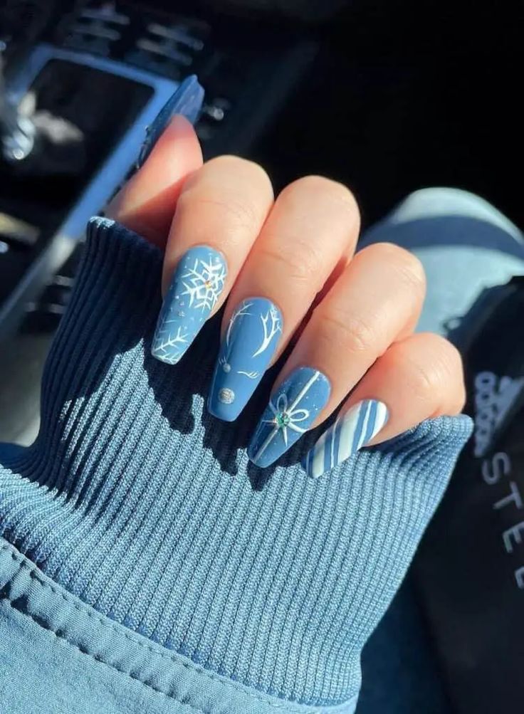 Chic Winter-Inspired Blue Nail Design with Elegant Accents