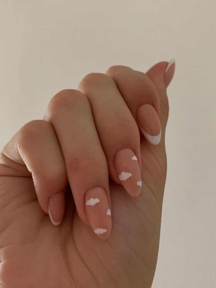 Elegant Cloud-Themed Nail Design: Soft Nude Base with Playful White Tips for a Whimsical Summer Look.