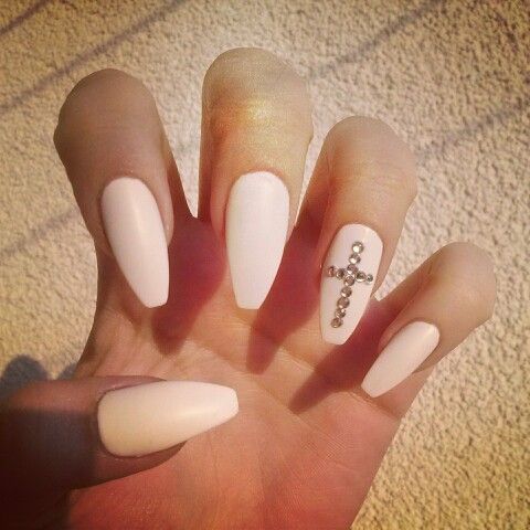 Sophisticated Almond-Shaped Nails with Matte White Finish and Rhinestone Cross Design.