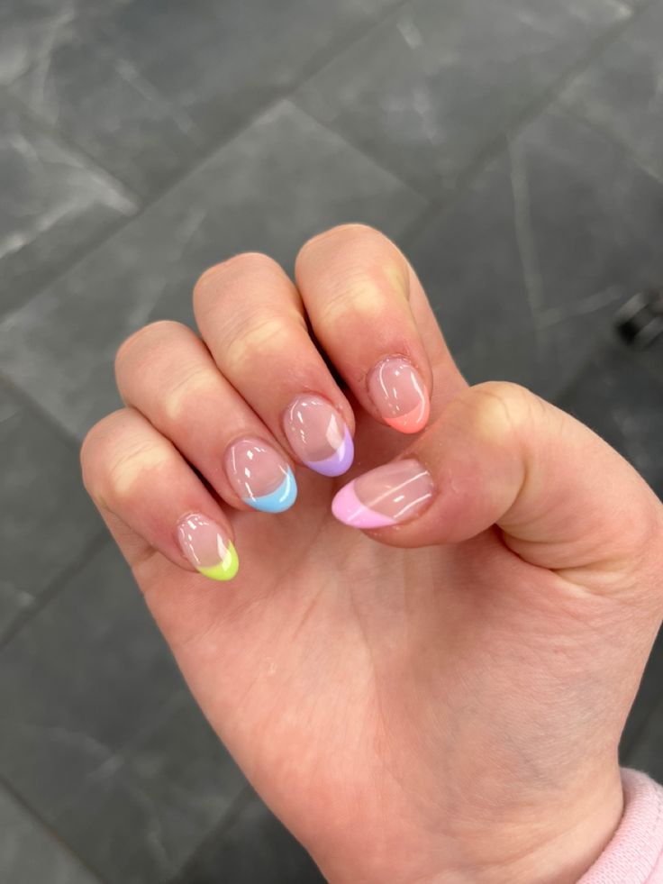 Vibrant Pastel French Tip Nail Design with a Fresh Transparent Base.